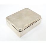 A silver cigarette box with wooden lining. Hallmarked Birmingham 1963 maker W T Toghill & Co.