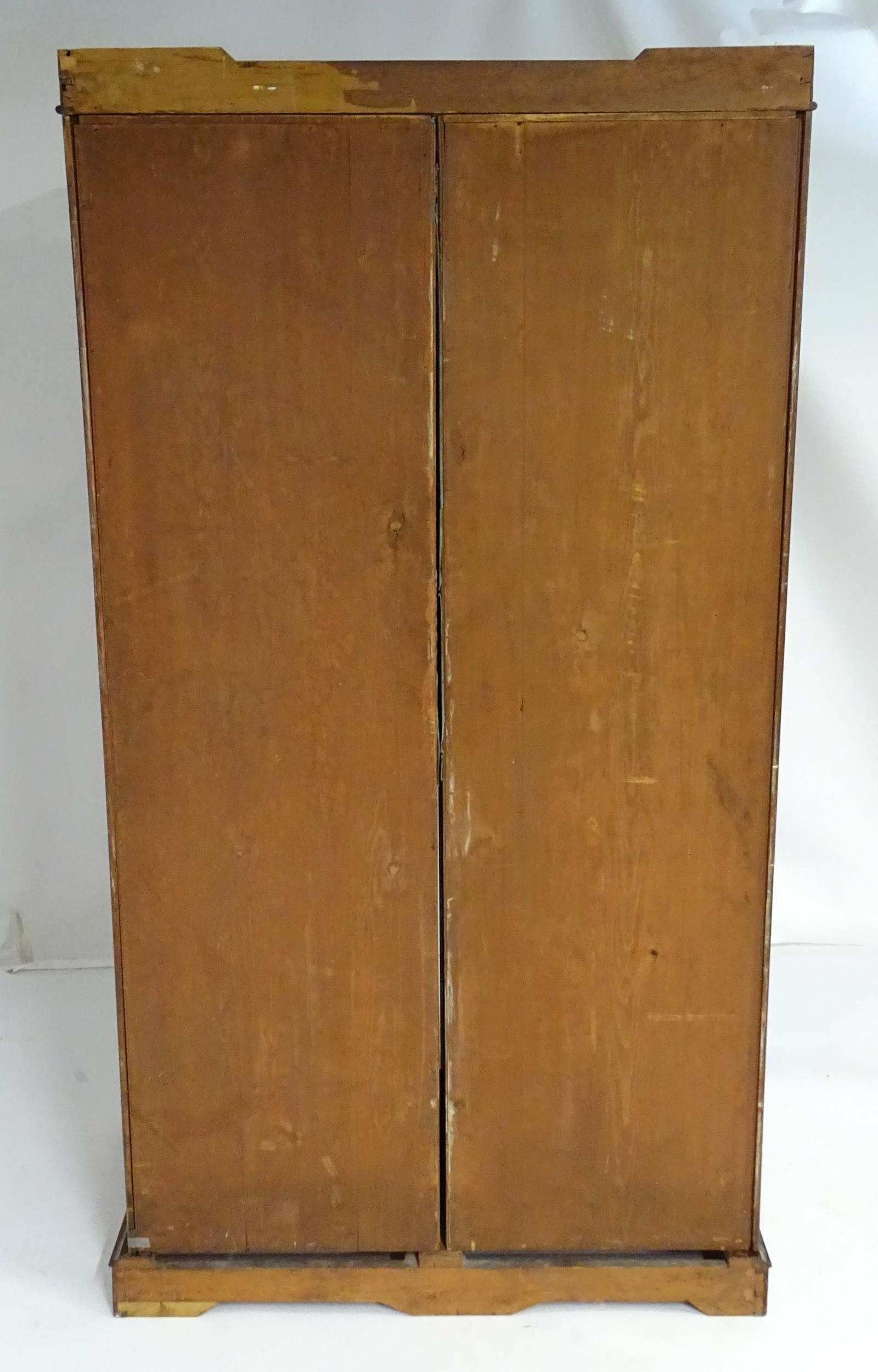 A mid 19thC mahogany double wardrobe with two panelled doors adorned with carved foliage and opening - Image 2 of 9