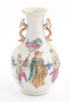A small Chinese famille rose vase with twin handles of ruyi sceptre form, the body decorated with