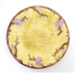 A Victorian majolica Joseph Holdcroft plate of circular form decorated with cherry blossom