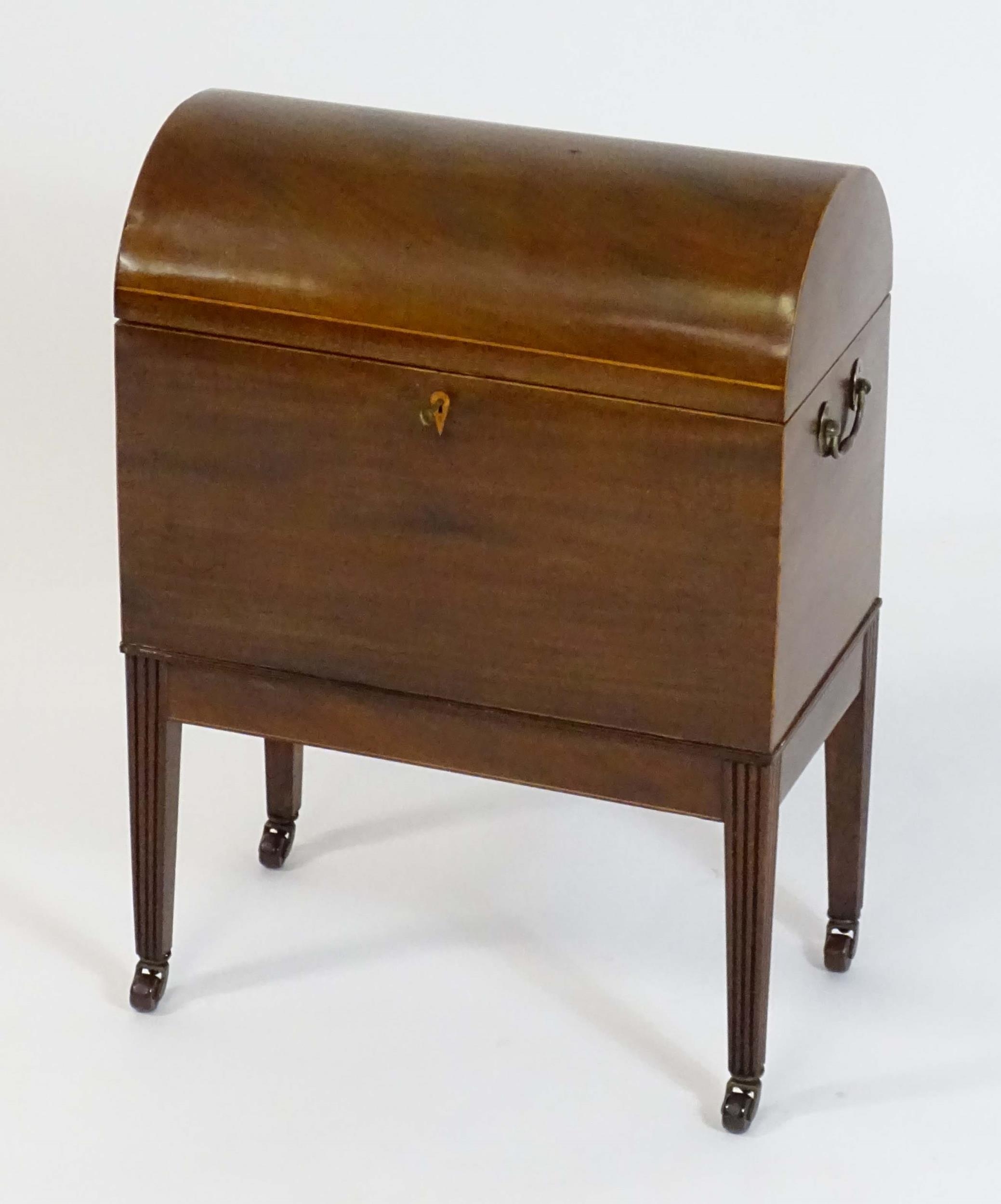 A George III mahogany domed lidded cellarette fitted with dividers for eight bottles, flanked by - Image 3 of 10