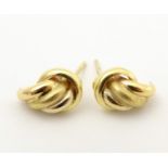 A pair of 18ct gold stud earrings. Approx. 1/2" long Please Note - we do not make reference to the