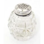 A glass pepper pot with lid marked Sterling Silver 2" high Please Note - we do not make reference to