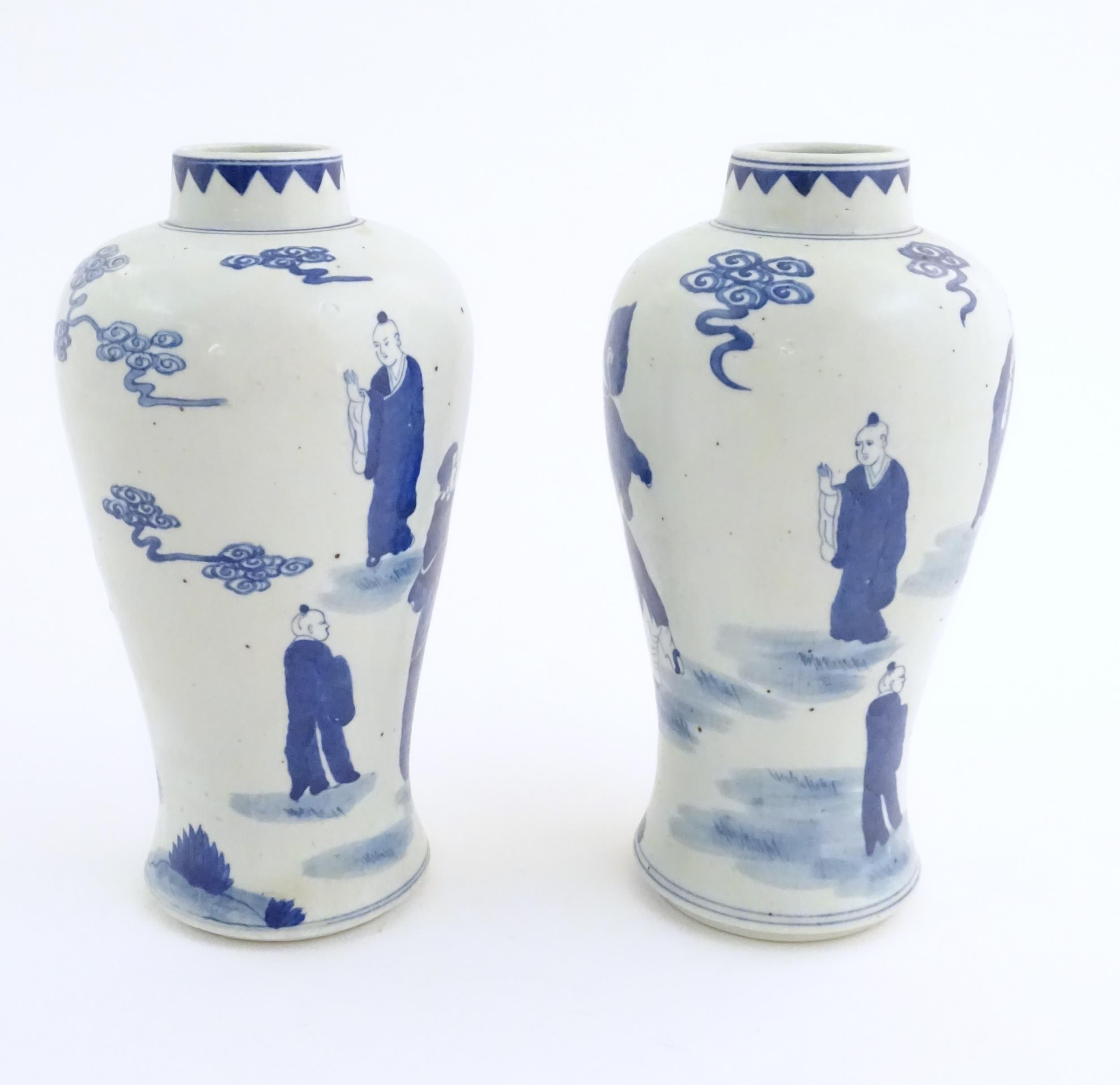 A pair of Chinese blue and white vases decorated with a Chinese dragon parade with figures in a - Image 4 of 6