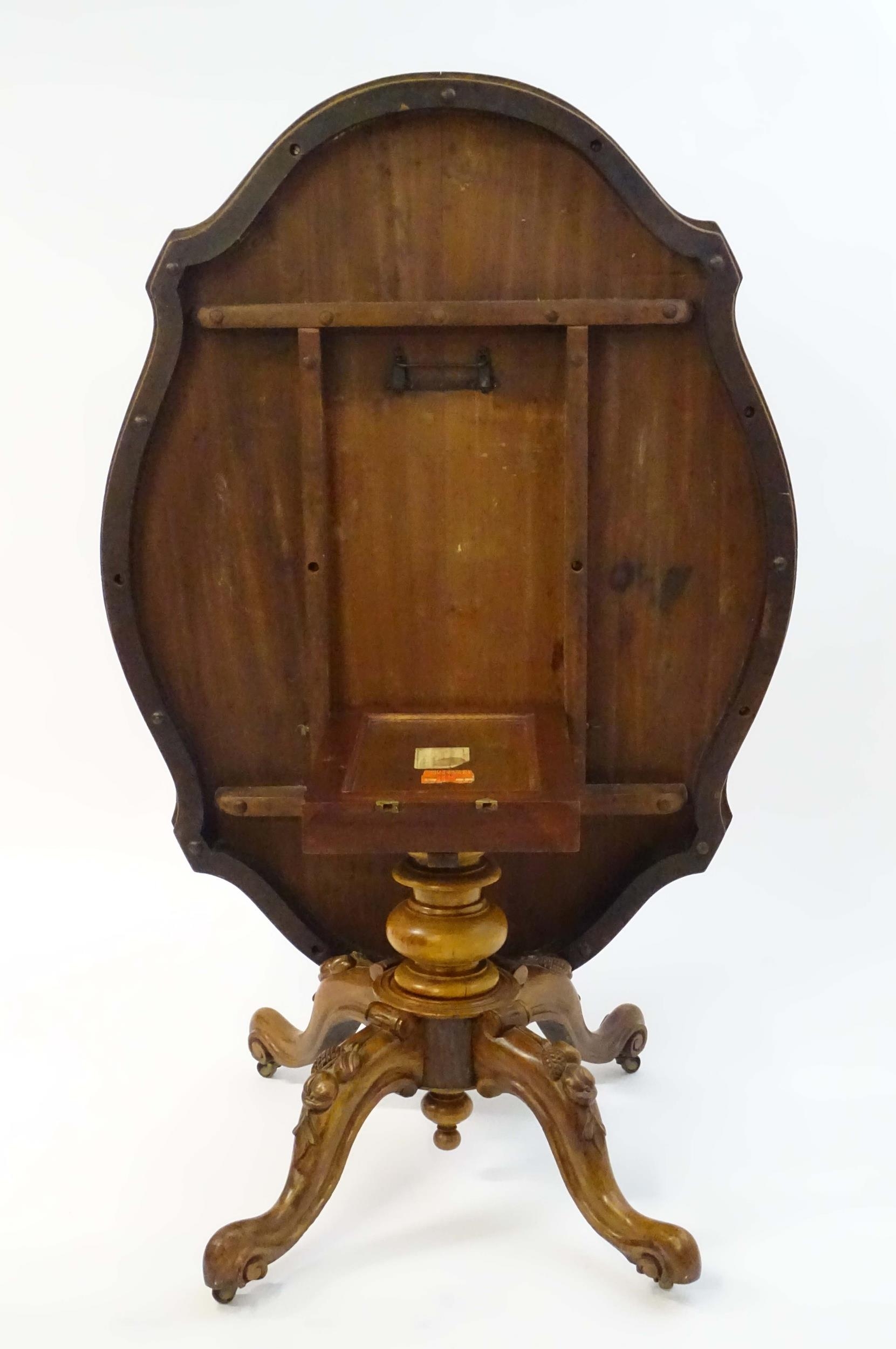 A mid 19thC walnut loo table with a burr walnut veneered top above a turned pedestal base and four - Image 2 of 12