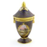 A Royal Doulton pedestal pot and cover with gilt finial and banded detail, the body with hand