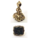 A 19thC yellow metal pendant fob seal set with bloodstone seal under titled May It Be Thine. Approx.