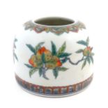 A Chinese brush pot of domed form decorated with foliage and fruiting pomegranates. Character