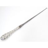 A Victorian silver handled button hook hallmarked London 1891 Approx. 15 1/2" long Please Note -