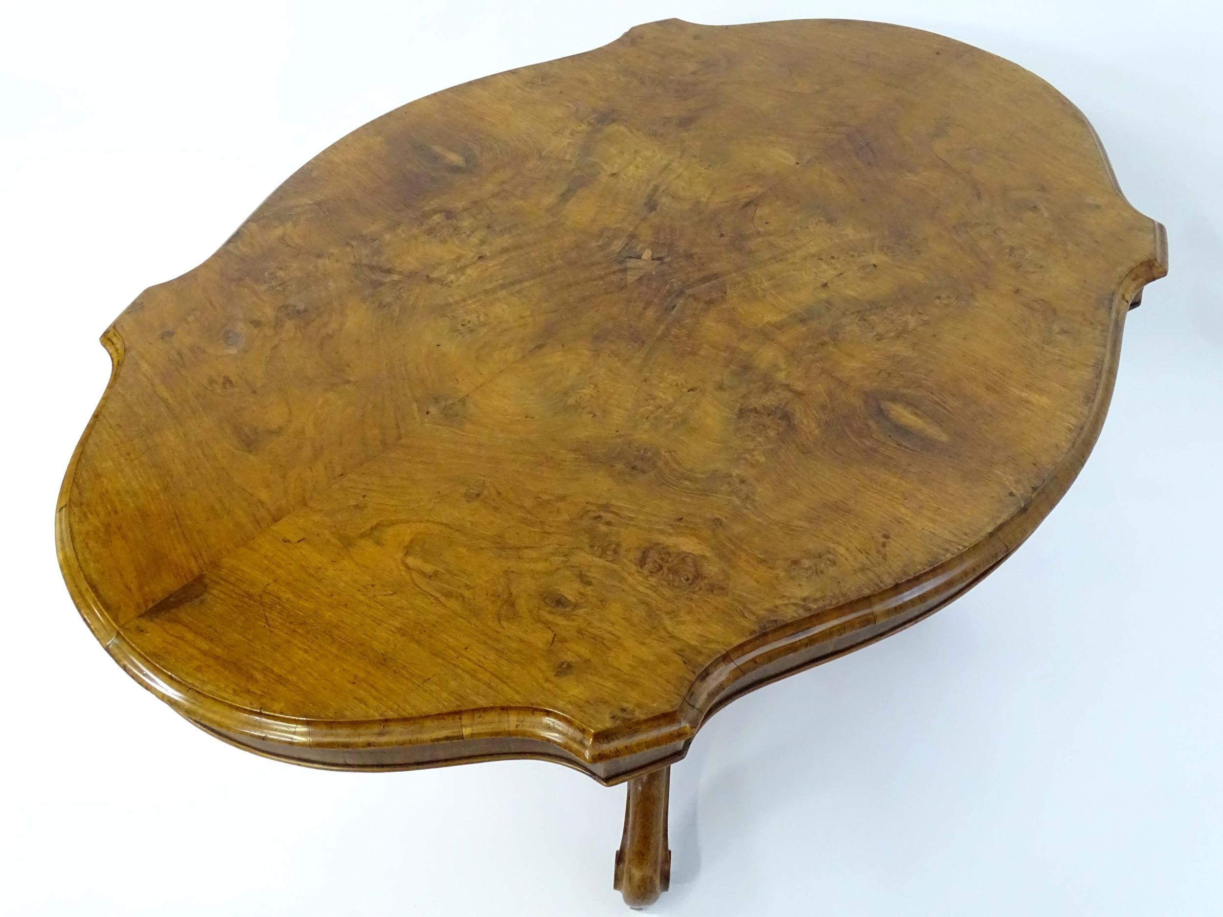 A mid 19thC walnut loo table with a burr walnut veneered top above a turned pedestal base and four - Image 7 of 12