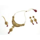 A suite of Asian wedding / bridal jewellery comprising necklace, earrings and maang tikka head