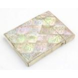 A Victorian mother of pearl card case with floral and foliate decoration. Approx. 4" x 3" Please