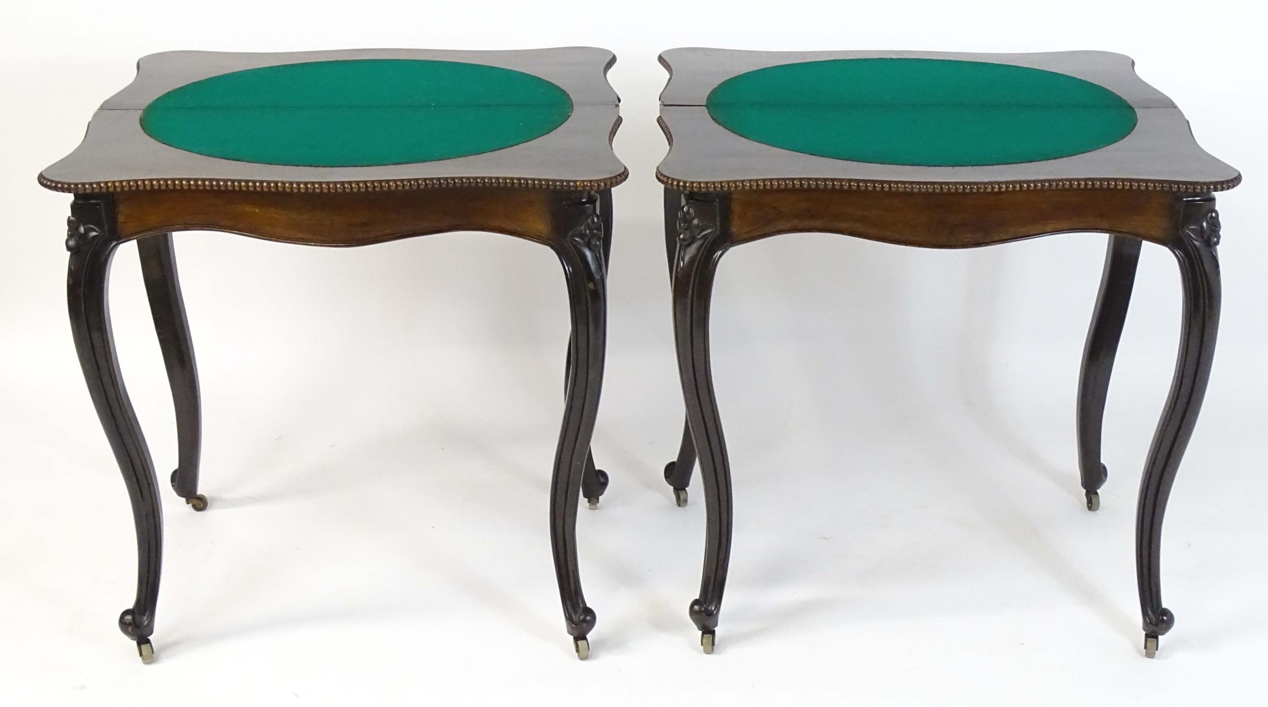 A pair of 19thC rosewood card tables of serpentine form, having beaded edges above floral carved - Image 14 of 18