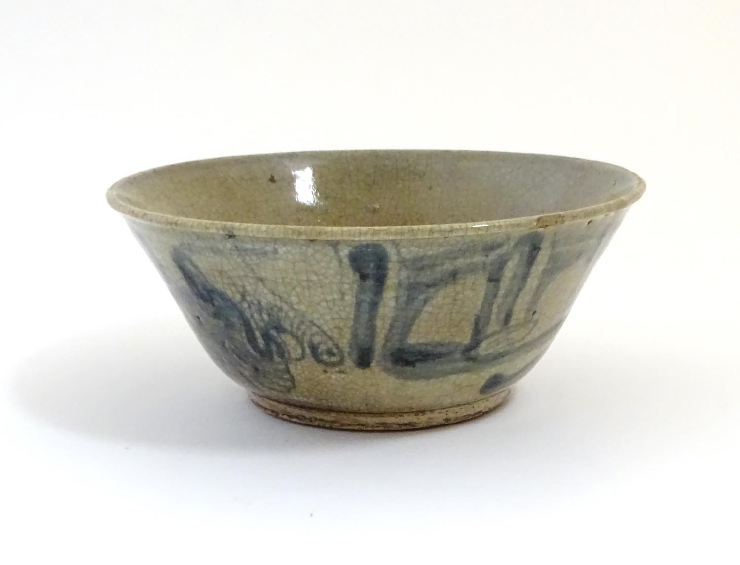 A Chinese crackle glaze bowl with blue brushwork detail. Approx. 3 3/4" high x 8 3/4" diameter