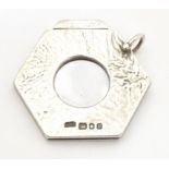 A silver cigar cutter of hexagonal pendant form, hallmarked London 1972, maker Ramsdon and Roed.