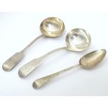 Two silver fiddle pattern sauce ladles, together with an Old English pattern dessert spoon. The