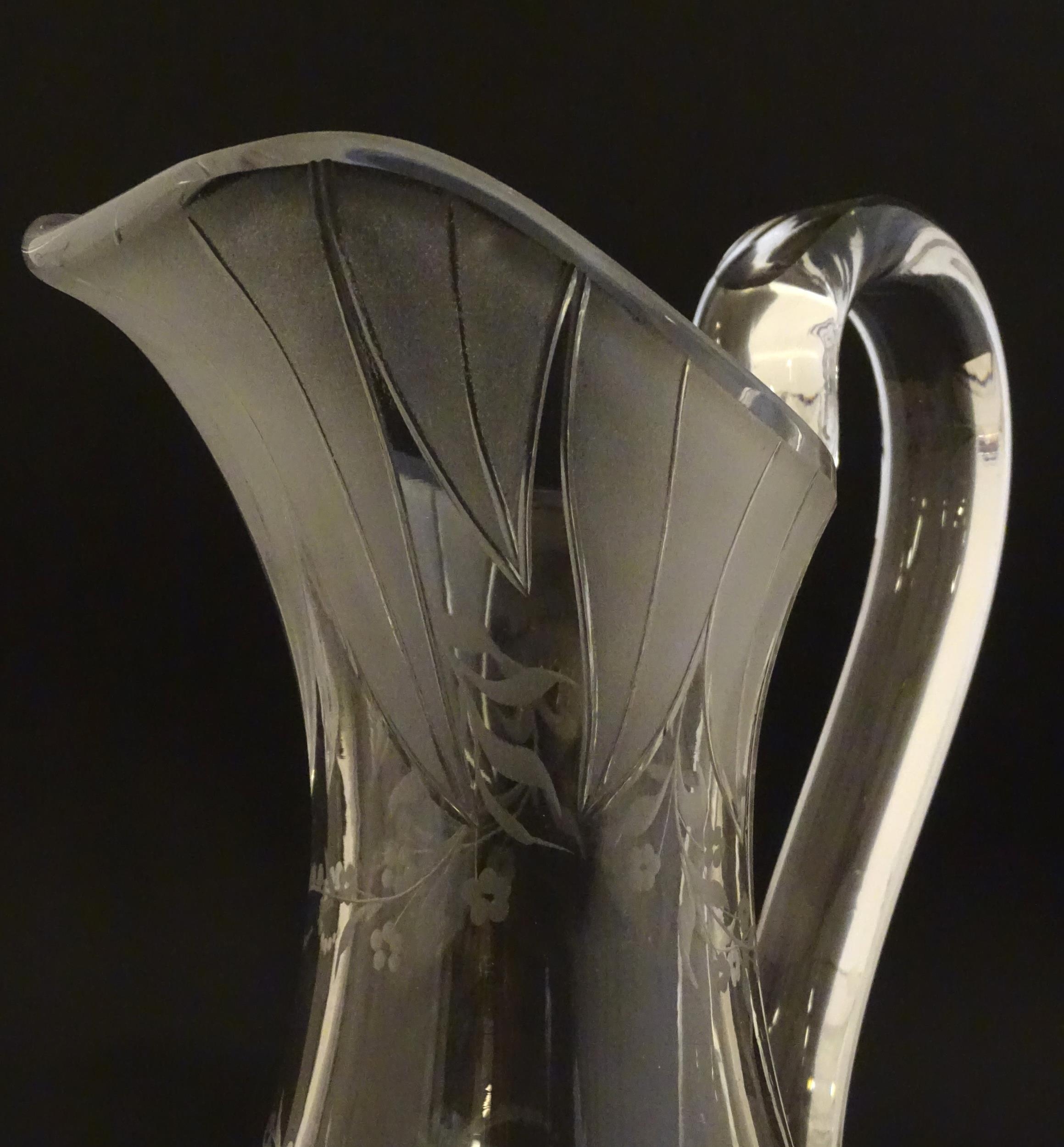 A pair of 19thC jugs with etched decoration depicting floral and foliate detail probably by - Image 5 of 9