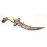 A 19thC Eastern Khanjar / Jambiya dagger, the curved 5 1/2" damascus blade with crossguard, bone
