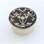 A silver and tortoiseshell pill box with pique decoration to lid. Hallmarked London 1912 Approx. 1