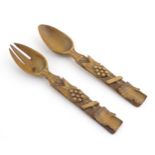 A pair of Continental carved wooden serving spoons / salad servers with stylised fruiting vine