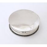 A Victorian silver pill box of circular form with gilded interior, hallmarked Birmingham 1897, maker