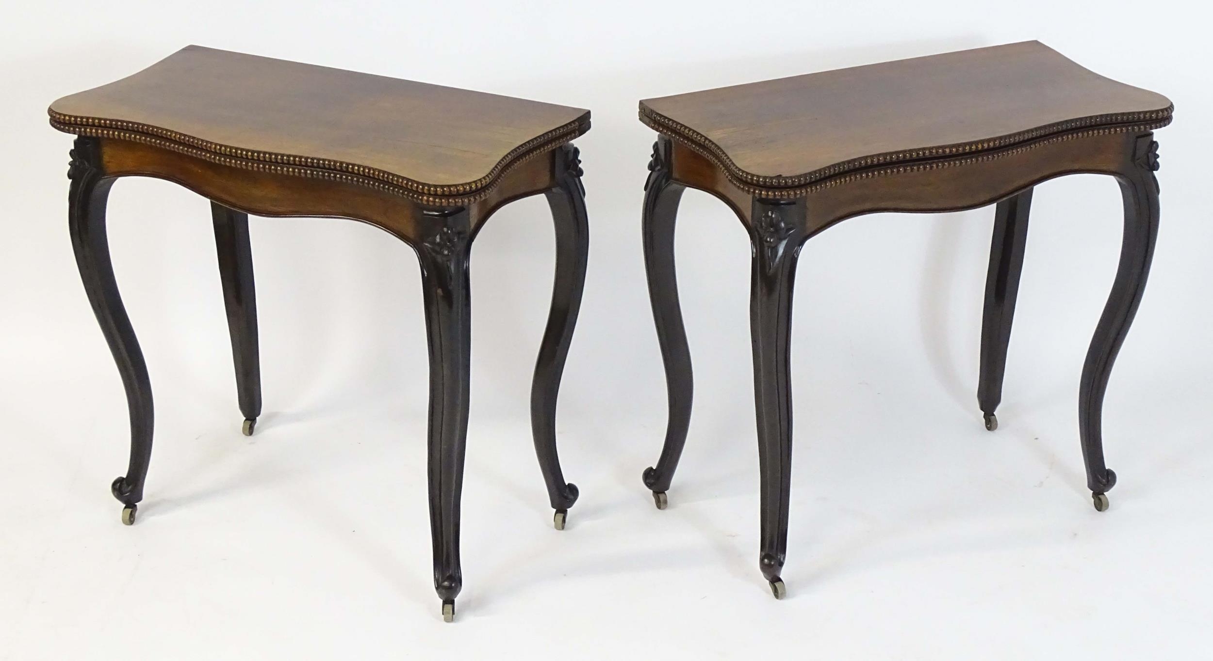 A pair of 19thC rosewood card tables of serpentine form, having beaded edges above floral carved - Image 12 of 18
