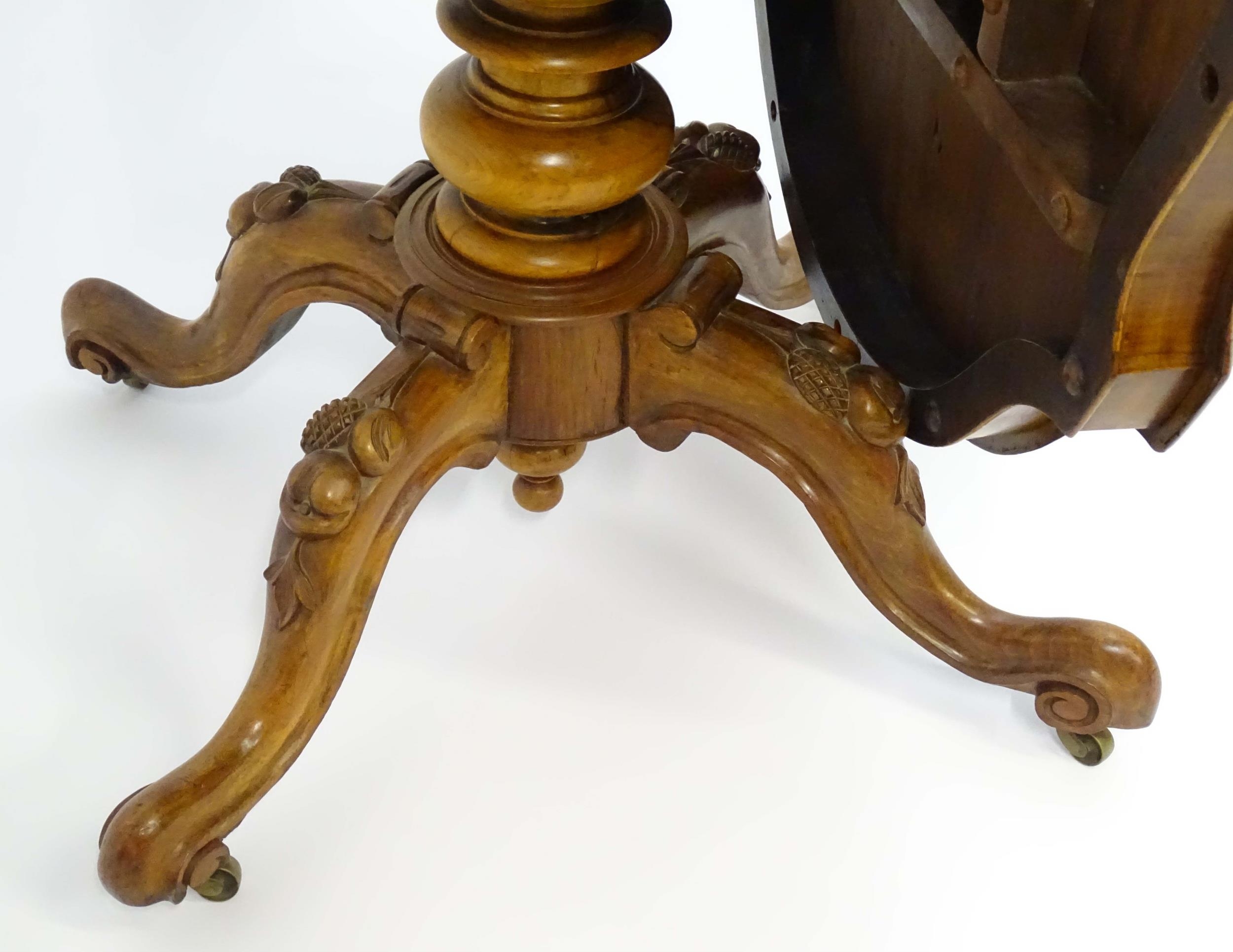 A mid 19thC walnut loo table with a burr walnut veneered top above a turned pedestal base and four - Image 11 of 12
