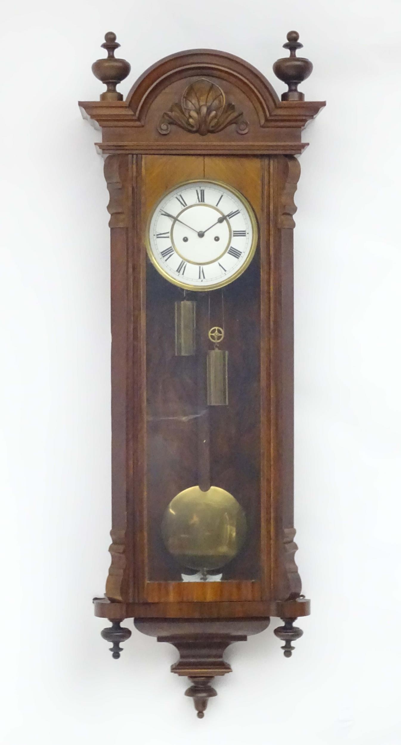 A Victorian walnut cased Vienna regulator wall clock with twin weight driven movement and white