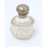 A cut glass scent bottle of spherical form with silver top hallmarked Chester 1921, maker William