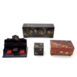 Four Oriental lacquered items comprising a desk tidy / organiser with shaped back decorated with a