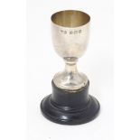 A small silver trophy cup on socle base, hallmarked Birmingham 1936, maker Marson & Jones. Approx. 2