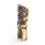 A North American carved bone figure with polychrome decoration. Possibly Haida / Tlingit. Approx.