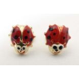 A pair of 14ct gold stud earrings formed as ladybirds / ladybugs with enamel decoration. Approx. 1/