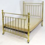 A Victorian brass bed with turned supports and surmounted by large ball finials. Total width 56",