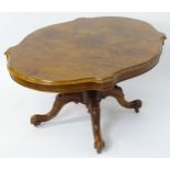A mid 19thC walnut loo table with a burr walnut veneered top above a turned pedestal base and four