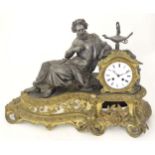 A 19thC French mantle clock with white enamel dial and cast classical scholar figural decoration.