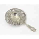 A Continental white metal strainer, probably Dutch. Approx. 5" long Please Note - we do not make