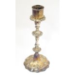 A silver plate candlestick with acanthus scroll detail. Approx. 11 1/2" high Please Note - we do not