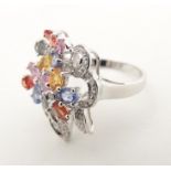 A 18ct white gold dress ring set with various coloured stones. Ring size approx. N Please Note -