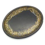 A 19thC papier mache lacquered tray of oval form with gilt foliate decoration and inlaid abalone