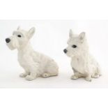 Two 20thC cast and painted models of seated terrier dogs. Approx. 7 1/2" high (2) Please Note - we
