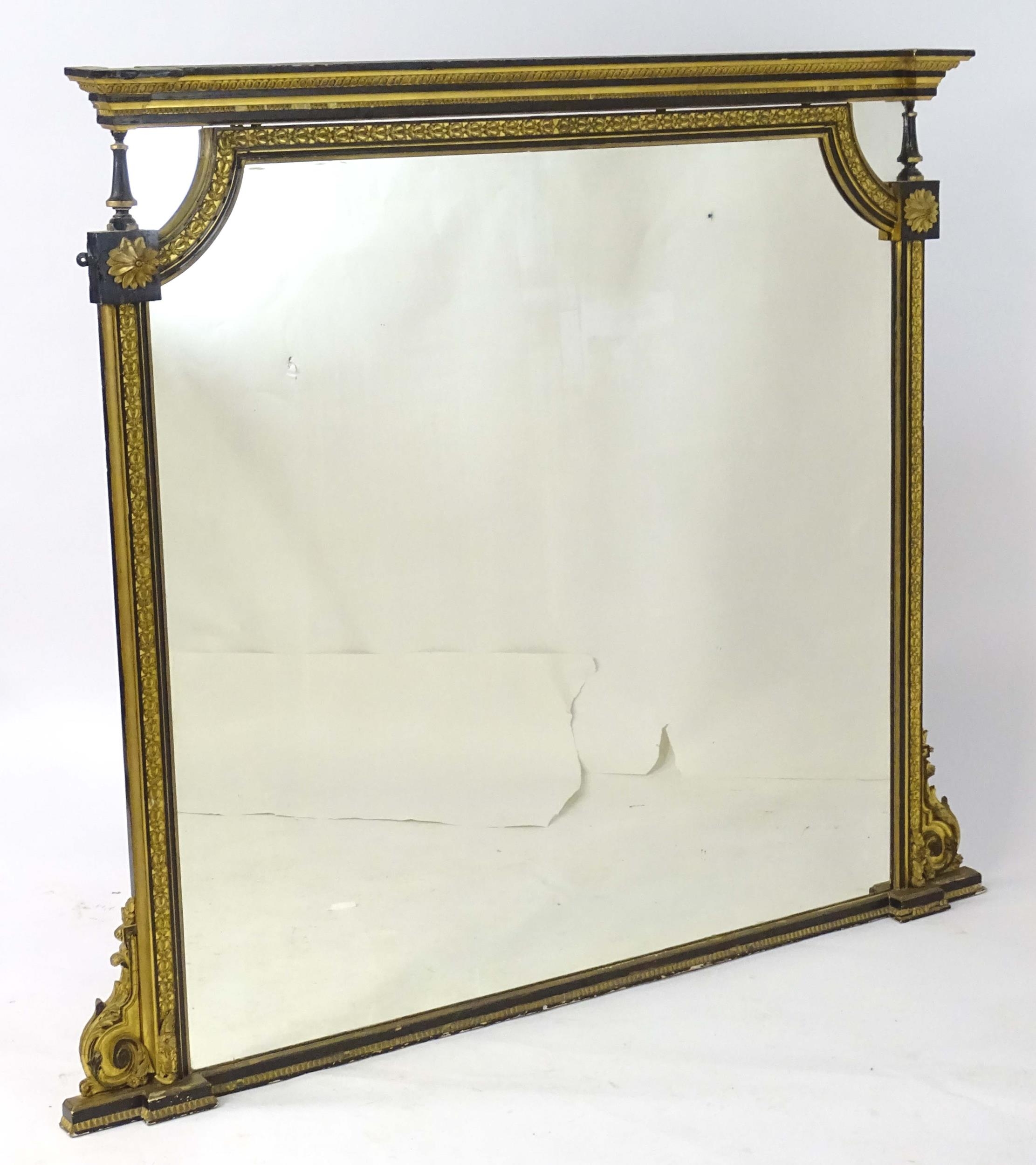 A Regency period over mantle mirror having a moulded cornice above gilt and gesso egg and dart