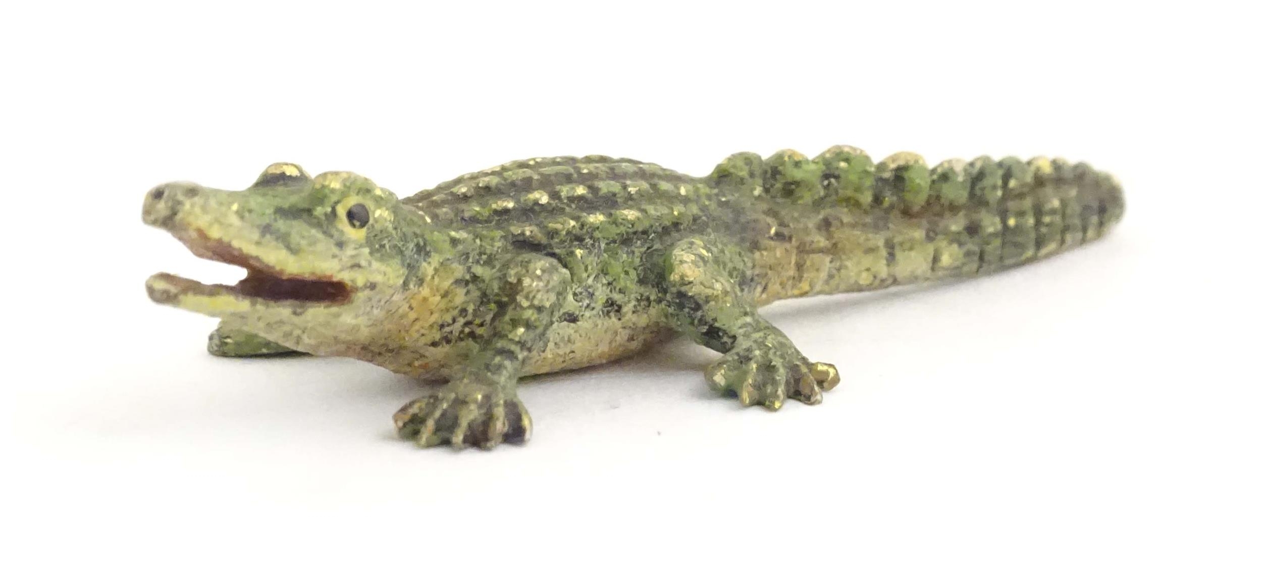 A cold painted bronze model of a crocodile / alligator. Approx. 2" long Please Note - we do not make