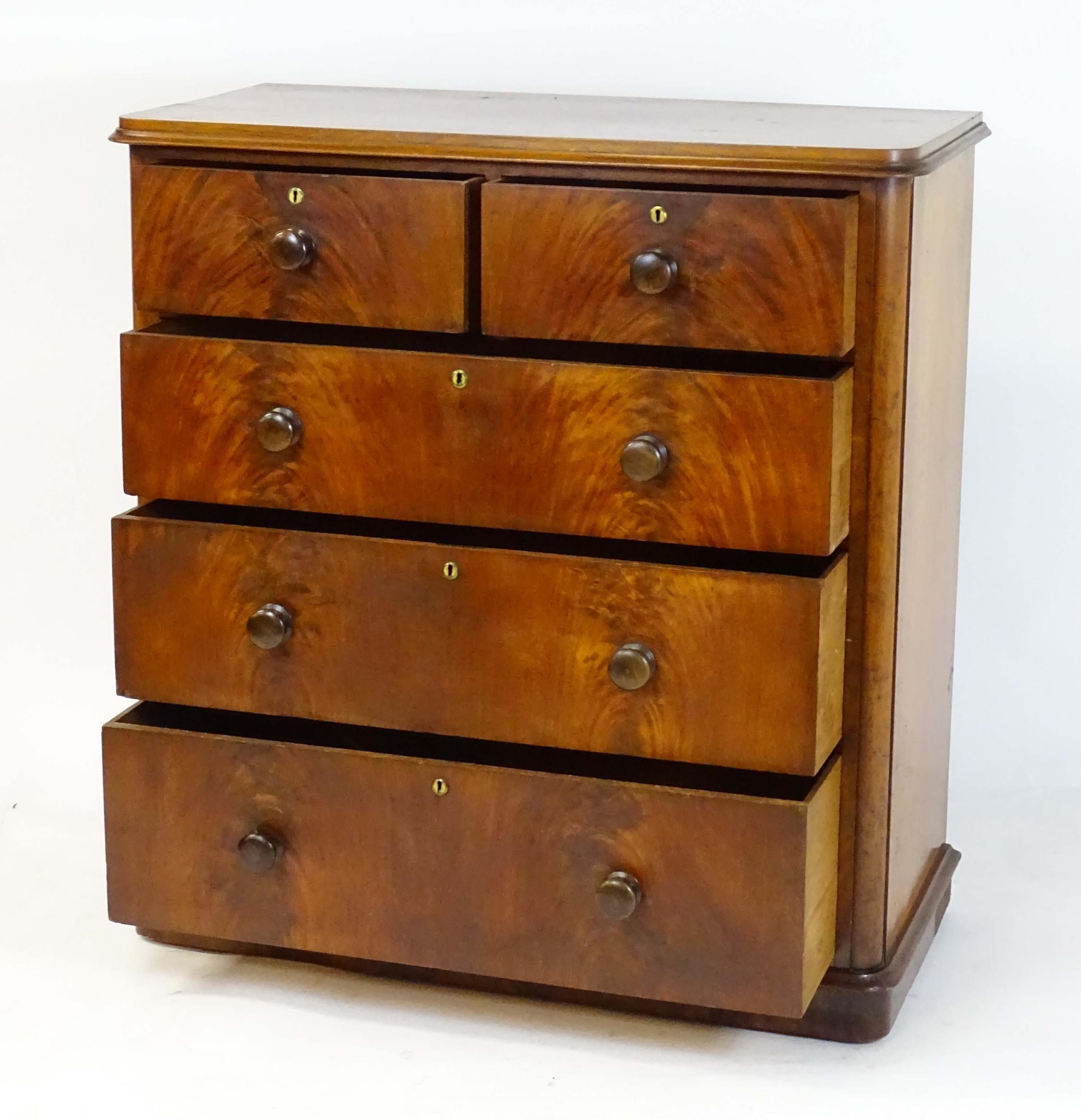 A large Victorian mahogany chest of drawers with a moulded top above two short over three long - Image 9 of 13