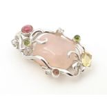 A .925 silver pendant set with central rose quartz and various coloured stone. Approx. 1 3/4" long
