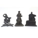 Three assorted cast fireplace / fireside ornaments / door stops / porters to include King William