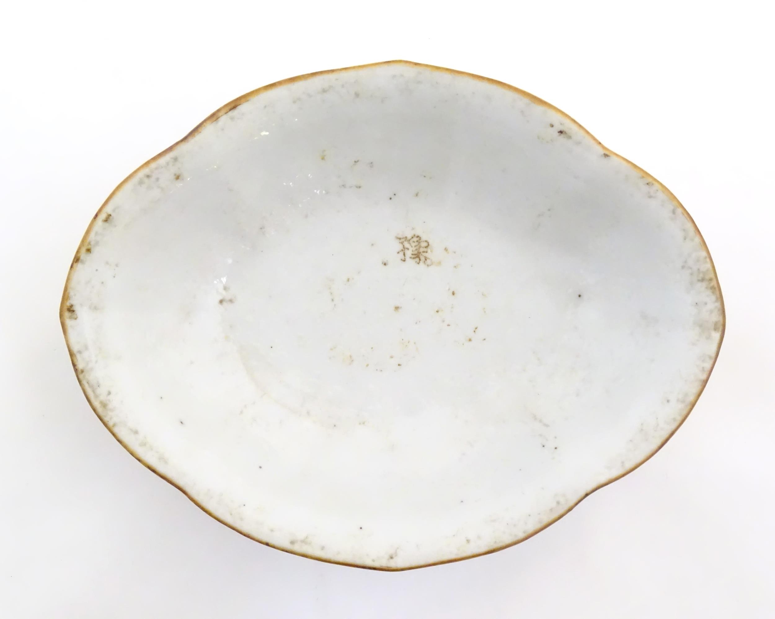 A Chinese footed bowl of lozenge form decorated with figures, vases and Character marks / script. - Image 6 of 6