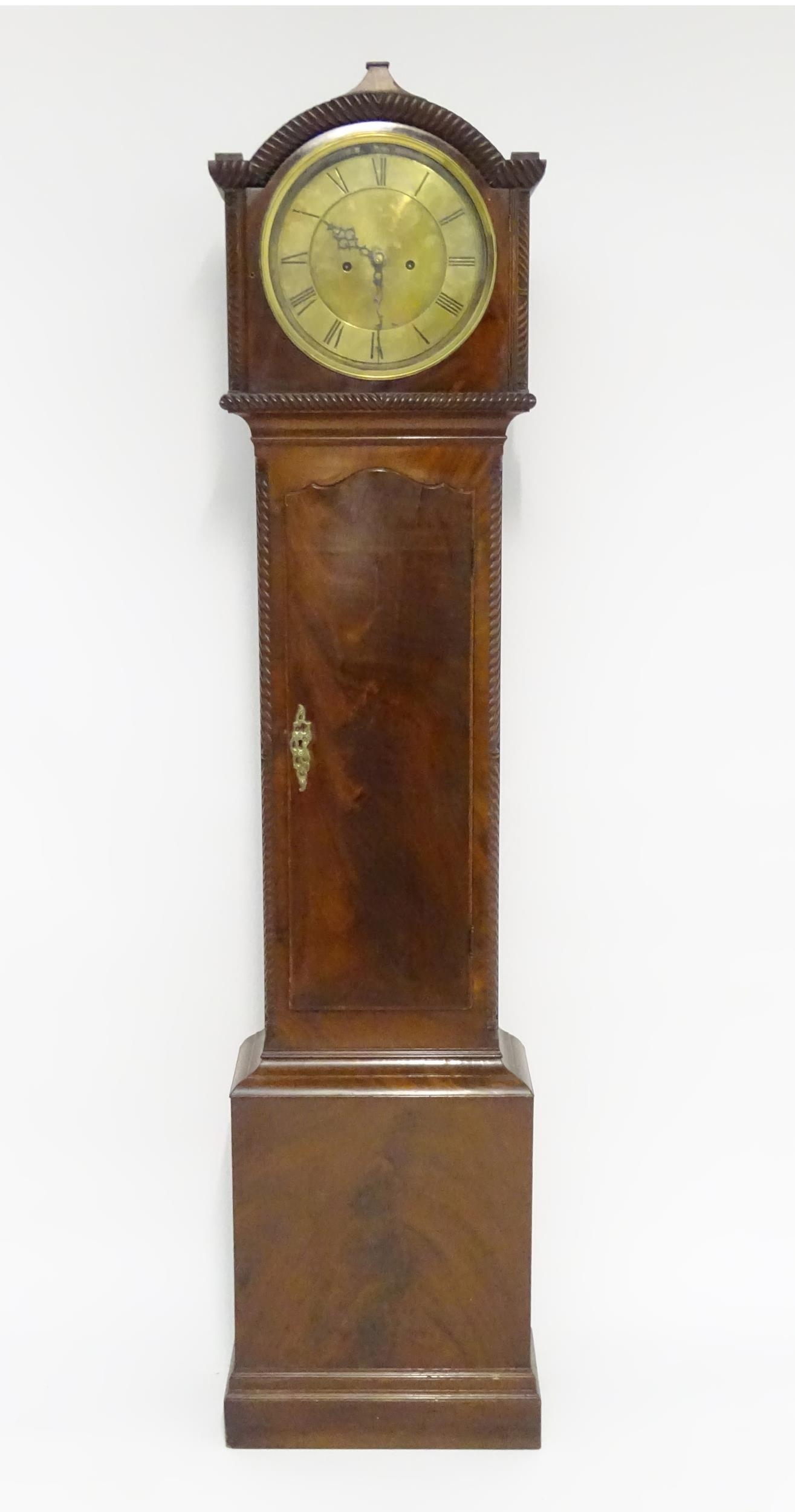 A 19thC mahogany longcase clock, the 8-day movement with circular silvered brass dial. Approx. 79"