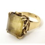 A 9ct gold dress ring set with citrine. Ring size approx. P 1/2 Please Note - we do not make