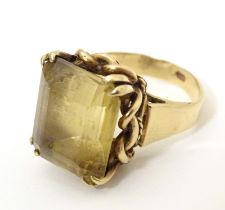 A 9ct gold dress ring set with citrine. Ring size approx. P 1/2 Please Note - we do not make
